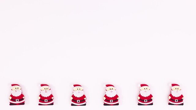Christmas Santa Clouse rotating on bottom of white theme. Stop motion