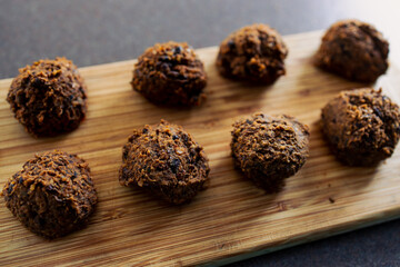 plant-based food, vegan meatballs made of black beans mushroom mince and textured vegetable protein on cutting board