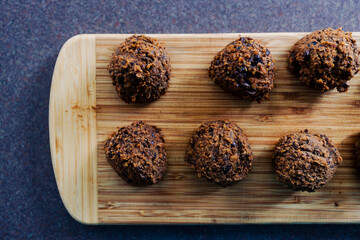 plant-based food, vegan meatballs made of black beans mushroom mince and textured vegetable protein on cutting board