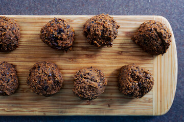 plant-based food, vegan meatballs made of black beans mushroom mince and textured vegetable protein on cutting board