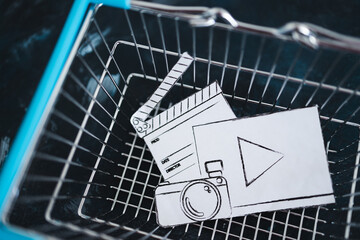 creative content sold online, photo and video digital downloads icon in shopping basket