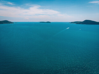 Fototapeta na wymiar Top view aerial photo from flying drone of an amazing seascape with paradise beach and sea with turquoise water. Summer vacation holidays in Thailand. Perfect website background with copy space area