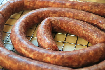 Fototapeta premium Closeup of raw coiled ham and garlic sausage