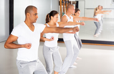 Fototapeta na wymiar Men and women train in self defense courses in the gym