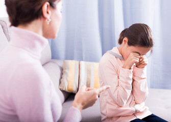 Mother scolding his teenage daughter for wrong things and bad behavior