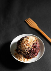 Black rice or organic rice berry with roasted coconut crust or Prik Gub Klur - authentic Thai local cuisine