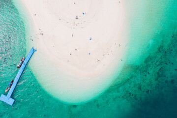 Aerial view of drone. Beaches and shops for food and beverage services on Khai Island, Phuket, Thailand, Seawater clear and blue green. Nature in Khai Island. At Khai island, Phuket, Thailand.