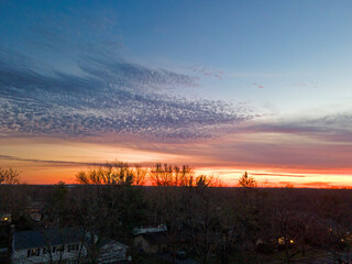 Panoramic aerial view of a beautiful sunset from above the tree tops of Old Bridge, New Jersey, with some cirrus clouds on the horizon -12