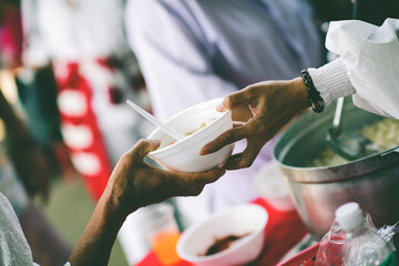 Volunteers Share Food to the Poor: Concept of food sharing for the poor to alleviate hunger