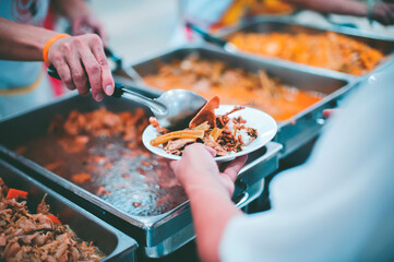 Volunteers Share Food to the Poor to Relieve Hunger: Concept poverty and donation