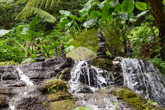 A balancing stone in the middle of waterfall