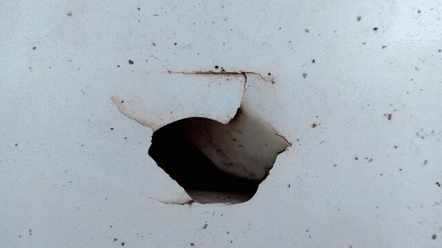 A hole in the plastic door