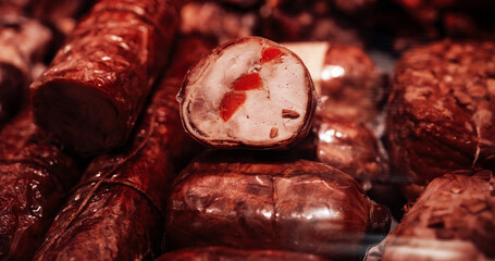 Close up photography of smoked fresh and quality meat in counter of butcher's shop.