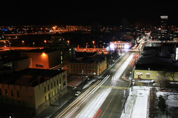 Fototapeta na wymiar Snow-covered streets in the night city of Chelyabinsk