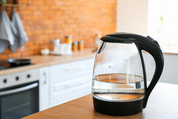 Electric kettle with water in kitchen