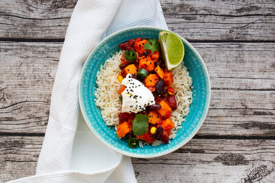 Chilli sin carne with black sesames seeds on a bed of rice