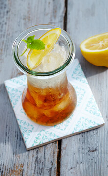 Homemade beer liqueur with corn schnapps, vanilla, crushed ice and lemon