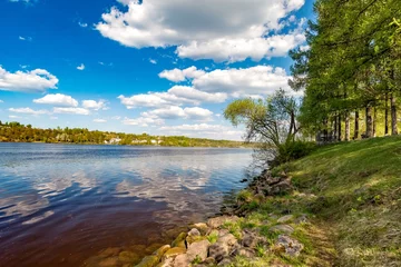 Foto op Canvas River banks against white clouds and blue sky in summer © Александр Коликов
