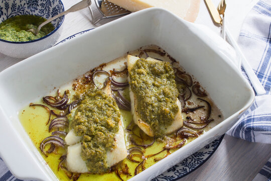 Zander fillet with a pesto crust on red onions