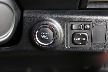Engine start button, Press the button to start the car automatically. Car start stop system with finger pressing the button.