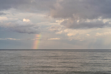 Obraz premium sea scape against rainbow background.