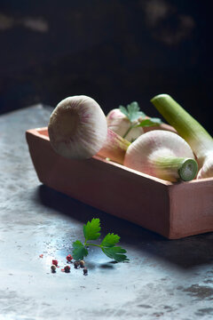 Fresh garlic in a bowl with parsley