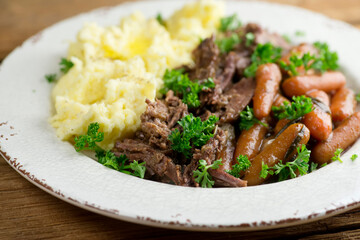 Pot roast with baby carrots and mashed potatoes