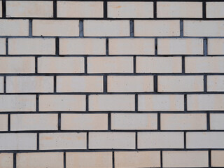 background wall made of bricks beige and gray cement