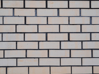 background wall made of bricks beige and gray cement