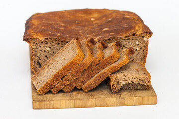 Rye homemade bread on wooden cutting Board on white background