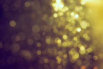 Gold bokeh blur defocus in black backgeound