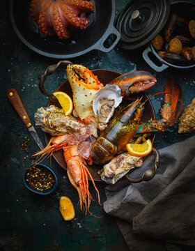 Seafood, fresh and cooked, with oranges and spices