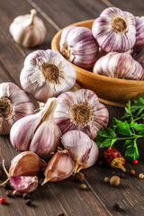 Closeup of Garlic bulbs on wooden table with garlics blur background.A set of fresh garlic on the chest wooden background.