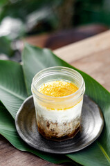 granola, coconut mousse, dates and turmeric powder healthy vegan dessert