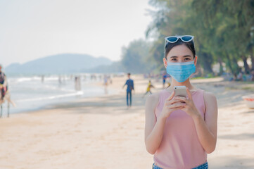 People wear facemask travel new normal smartphone take photo
