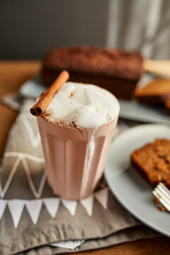 Cappuccino with cocoa and cinnamon stick