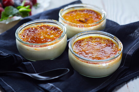 Cr�me br�l�e in three glass ramekins