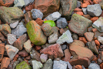 red stones close up lying on the ground