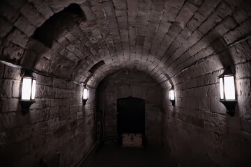 Fototapeta premium castle tunnel view, gloomy underground passage perspective, old european castle, abstract view