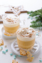 Eggnog with cinnamon and nutmeg  with small tree cookies for Christmas and winter holidays