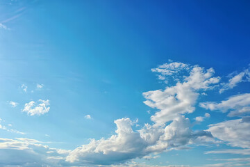 white clouds on blue sky background, abstract seasonal wallpaper, sunny day atmosphere