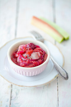 Soused herring salad with rhubarb, raspberries and red onions