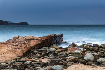 Sunrise seascape on an overcast morning at the beach