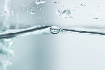 Bubbles in clean blue water ready to drink