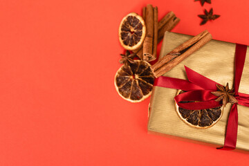 top view of gift with spices on red 