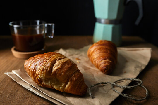 Fresh croissants with coffee