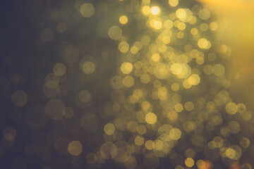 Obraz premium Gold bokeh blur defocus in black backgeound