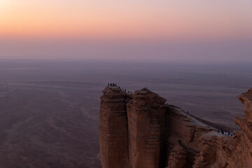 Tourists gather at Edge of the World escarpment near Riyadh, Saudi Arabia