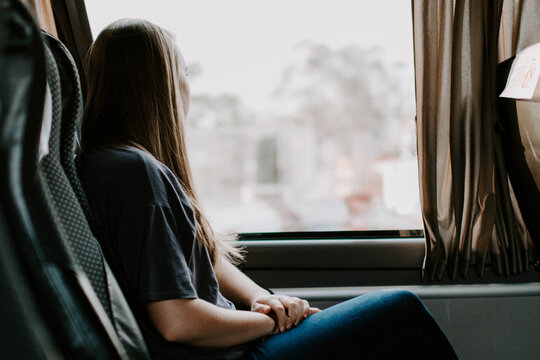 Closeup Shot Of A Lady In A Bus Looking Out Of The Window