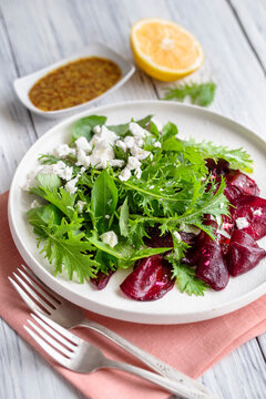 Greens salad with roasted beets, mizuna and feta